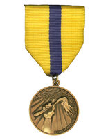 Medallón dorado de Excelencia